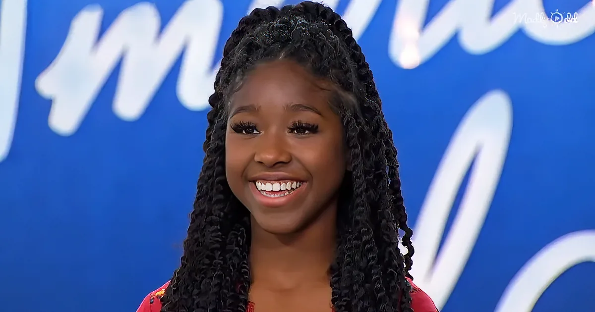 A smiling person with long, dark braids in front of a blue background with white text.