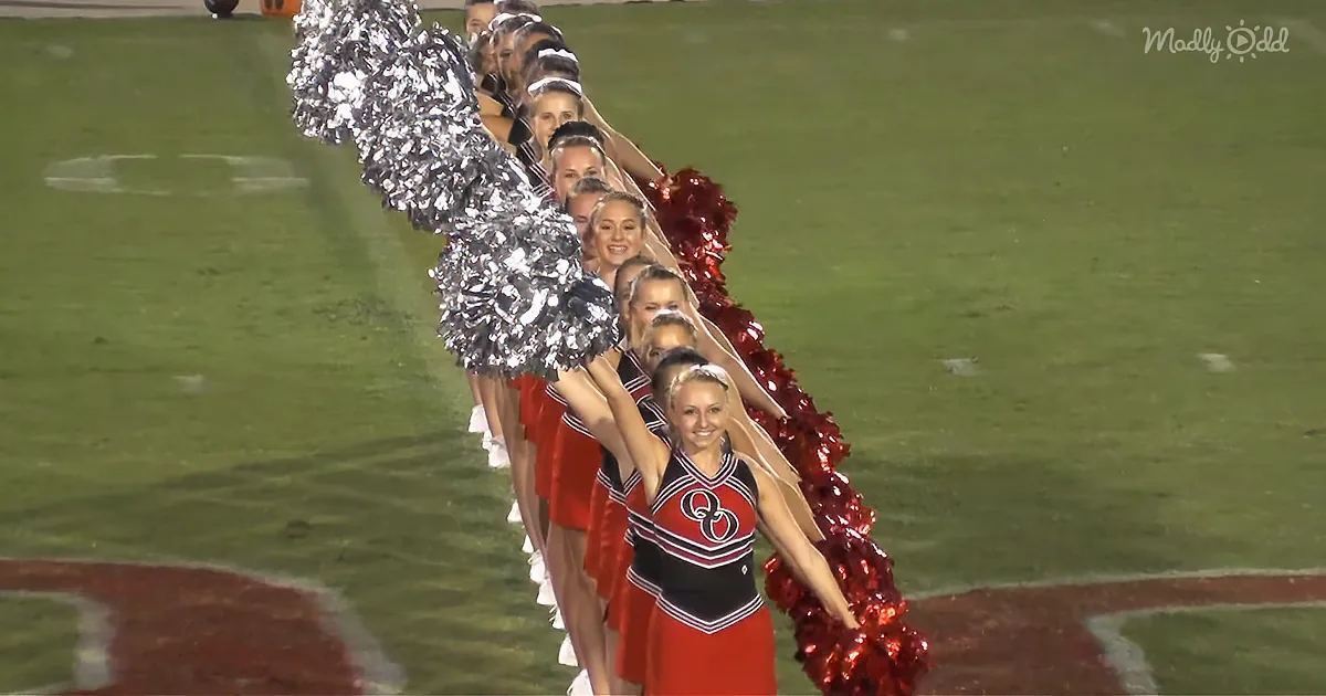 Crowd Screams as High School Cheer Squad Performs Eye-Catching Routine