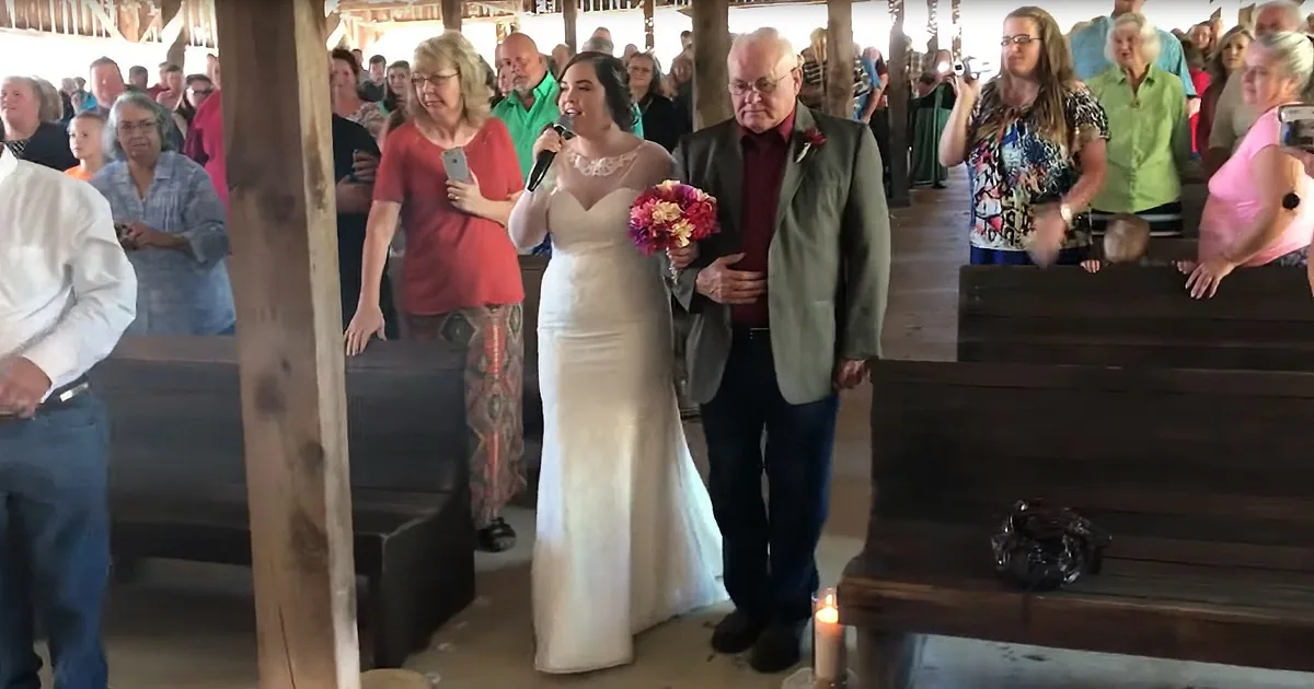 Bride Walks Down Aisle Singing Elvis Cover to Emotional Groom