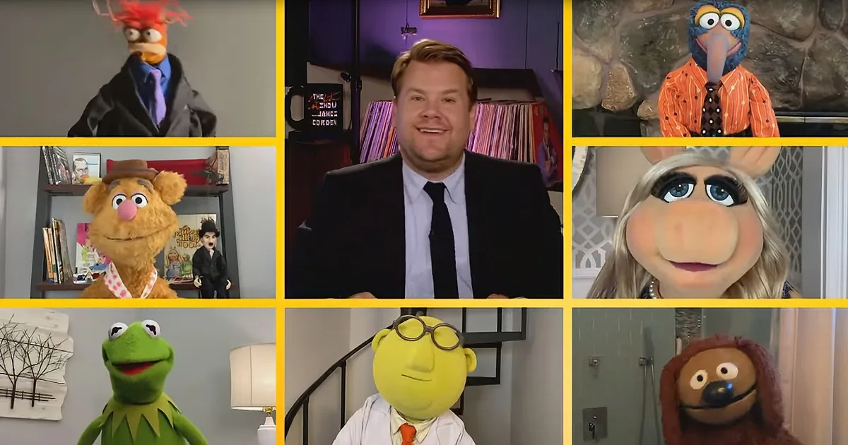 James Corden is surrounded by various Muppet characters in a virtual meeting setup.