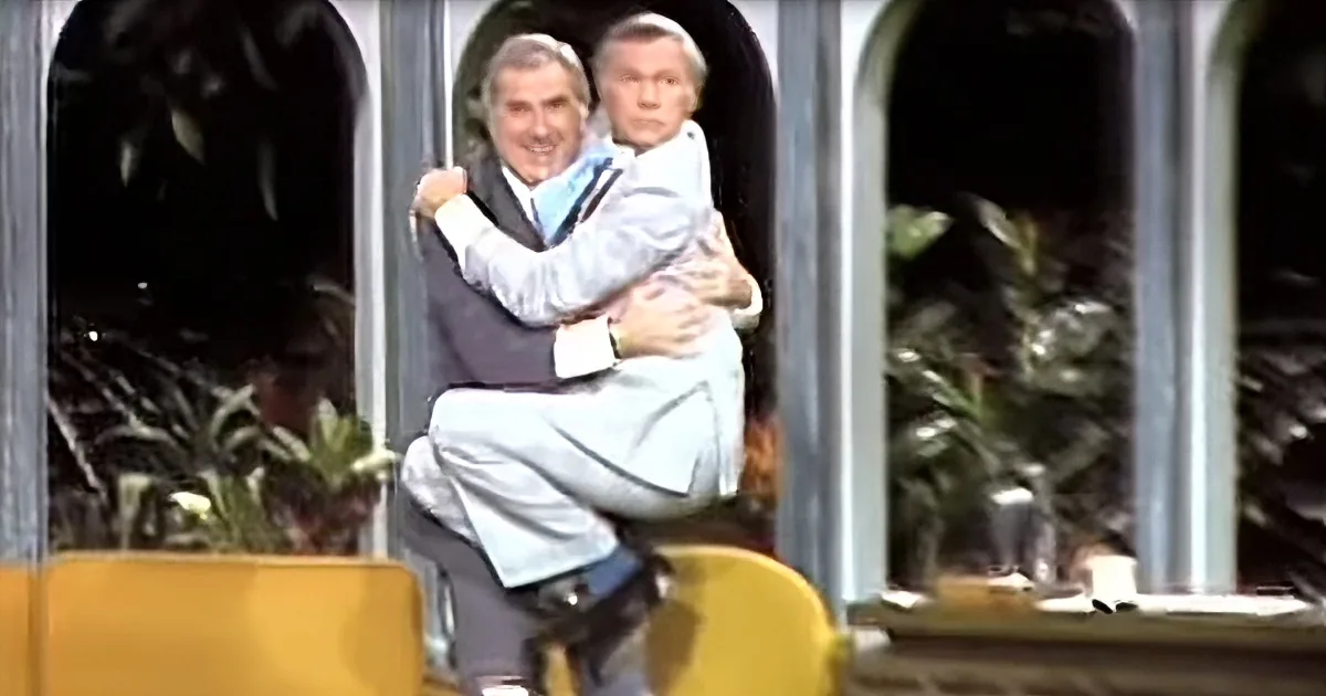 Startled Johnny Carson Takes Flying Leap Into Ed McMahon's Arms After Cheetah Takes a Swipe