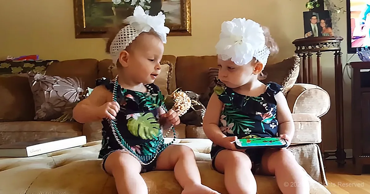 Twin Toddlers React in Their Own Special Way to Phone Game.