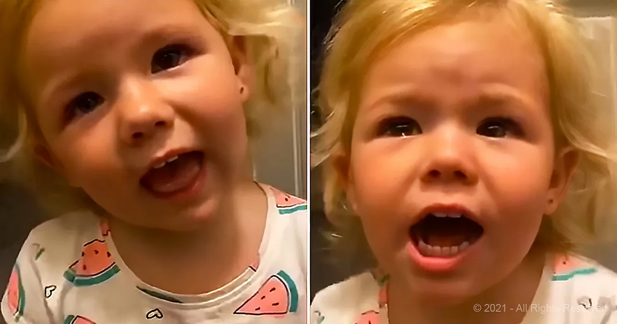 A toddler in a watermelon-patterned onesie is captured in two close-up shots, one with a surprised expression and the...