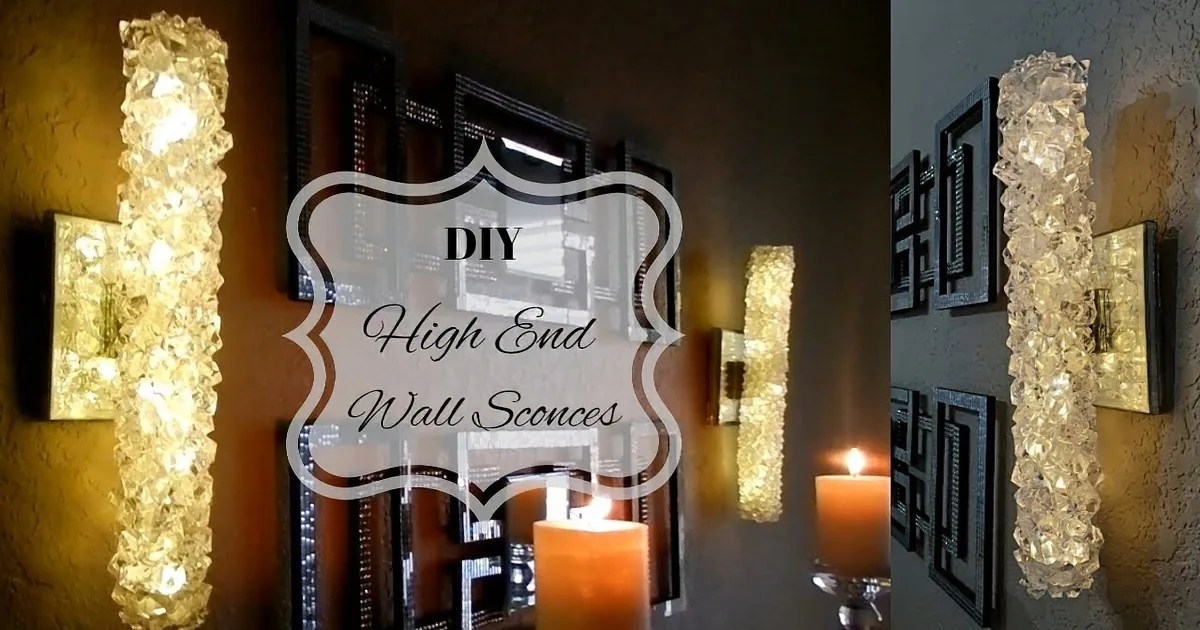 A wall-mounted crystal sconce with a lit candle below, casting a warm glow.