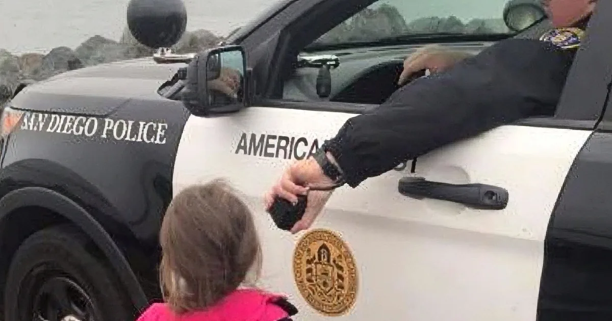 Officer Helps Girl Say Goodbye to Navy Dad as His Ship Departs