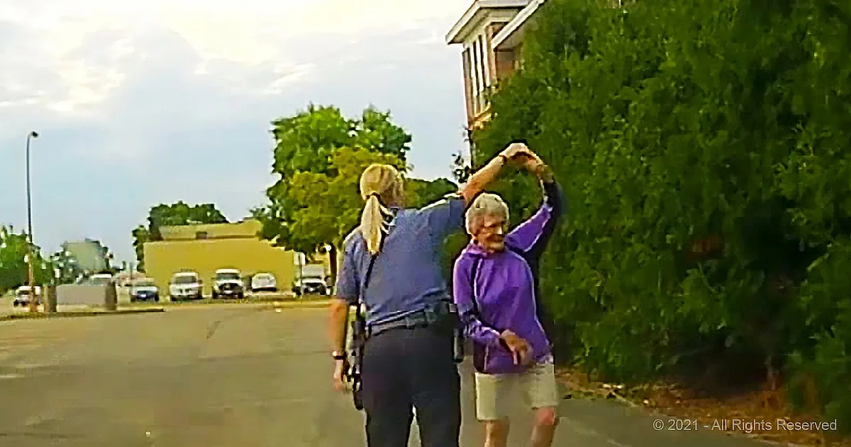 Cop Joins Elderly Lady Dancing on the Roadside