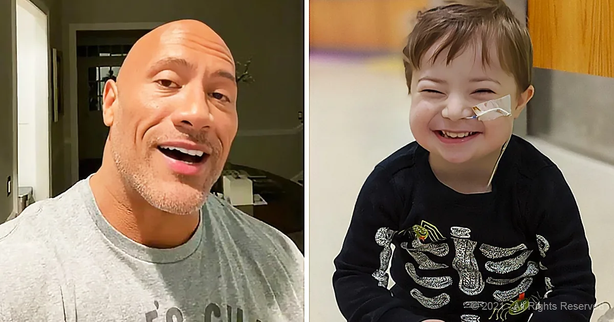 A man and a child smile, the man in a grey shirt, the child in a black shirt with a bandage on their nose.
