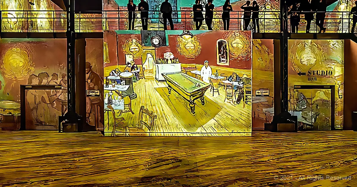 A vibrant, Van Gogh-inspired mural of a café scene projects onto a stage backdrop, with a bar and patrons depicted.