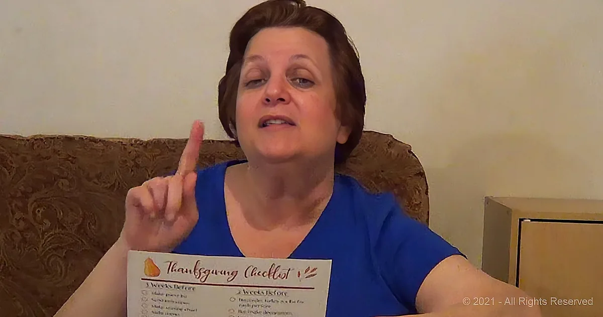 A woman in a blue shirt holds a "Thanksgiving Checklist" while pointing upwards.