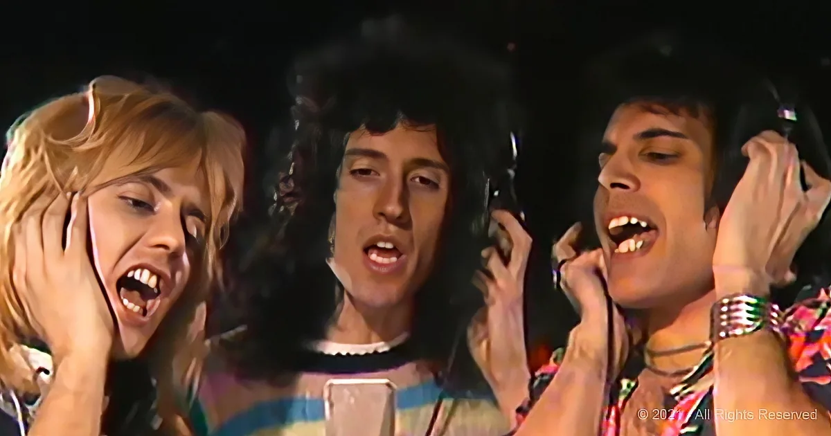 Three individuals with expressive faces, one holding a microphone, seemingly performing or singing.