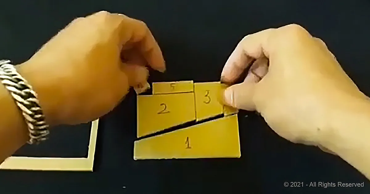 Two hands manipulate a yellow puzzle piece with numbered sections against a dark background.