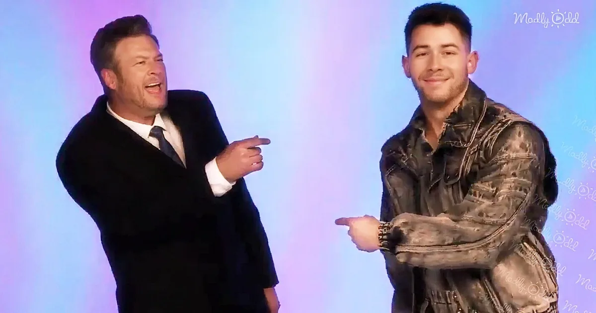 Two men, one in a suit and the other in a patterned jacket, are pointing at each other against a colorful background.