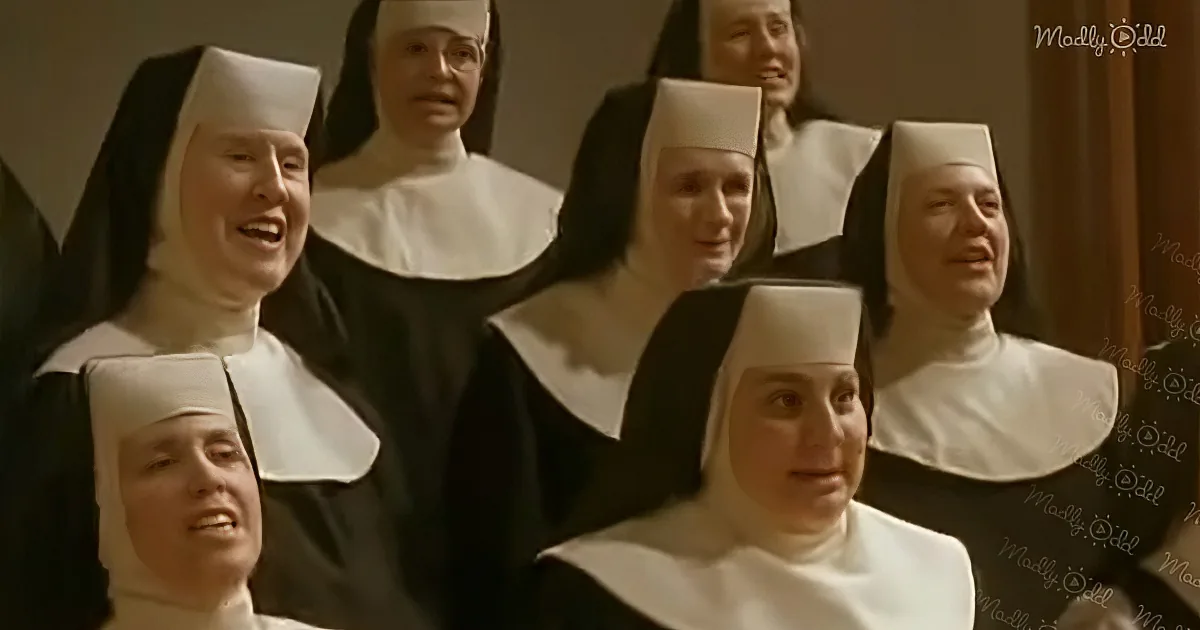 A group of nuns in black habits and white caps is smiling and laughing together.