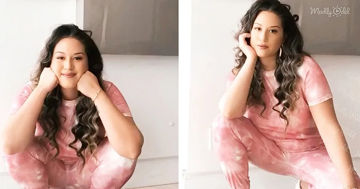 A woman with long, wavy hair in a pink outfit poses with her hands near her face in two different angles.