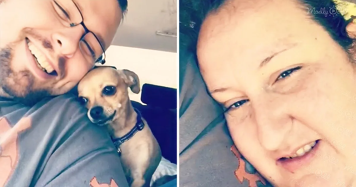A man and a small dog are smiling together in a selfie, with the man wearing glasses and the dog looking up.