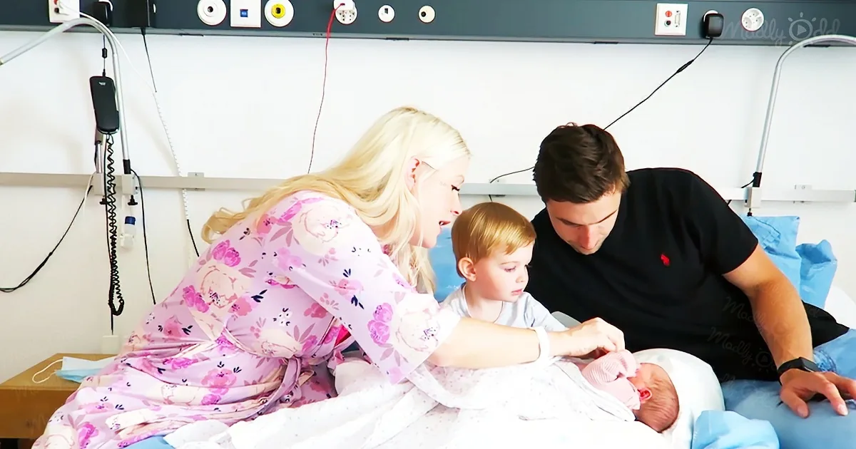 Toddler meets his baby sister for the first time