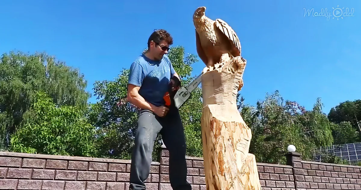Artist carves wooden eagles using a chainsaw