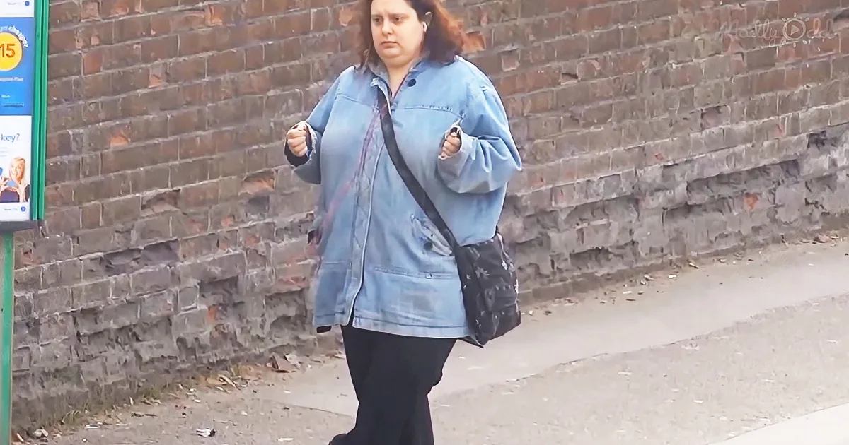 Woman dancing at a bus stop