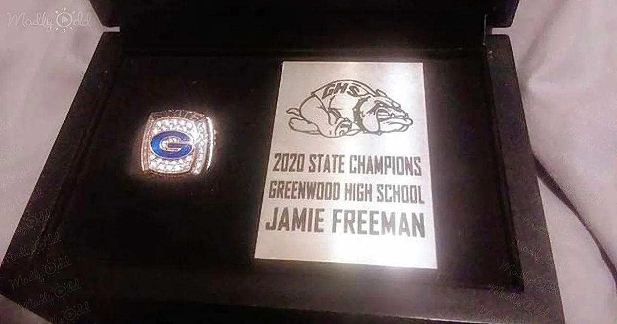School football team thanks janitor with Cerebral Palsy