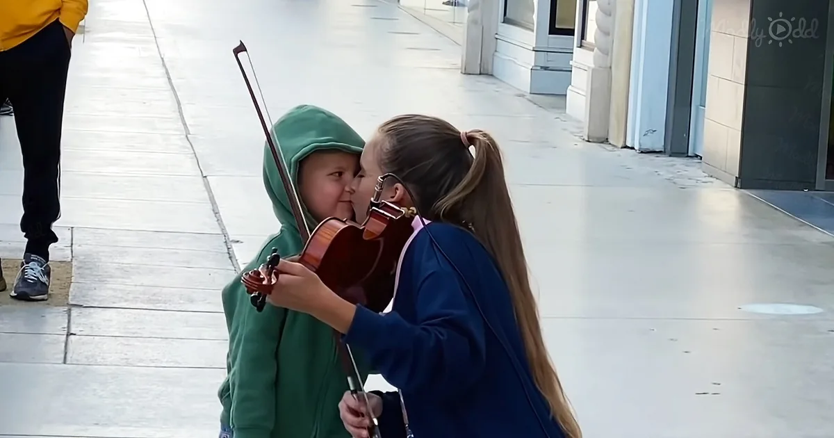 Adorable Little Boy Kisses Street Violinist