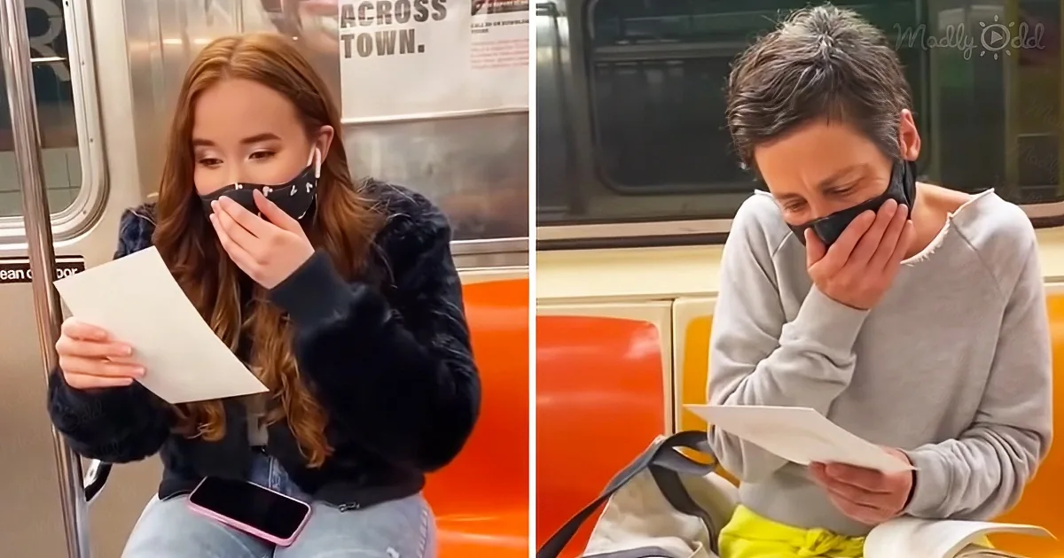 A woman and a man wearing masks, reading papers on a subway, with one holding a phone.