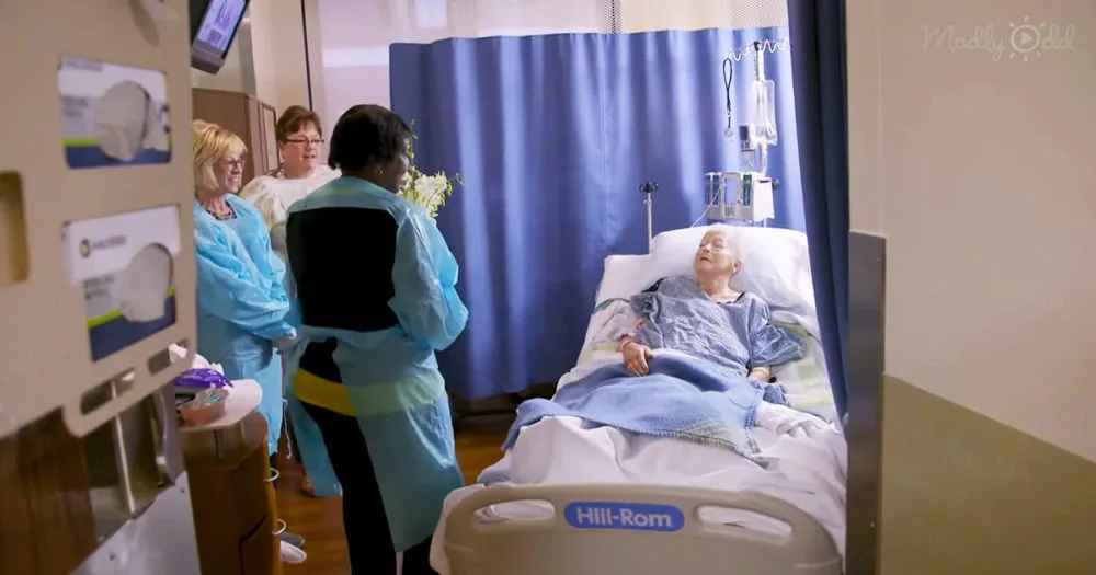 Doctor giving flowers to lonely patients