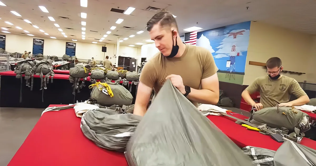 Soldiers packing parachute