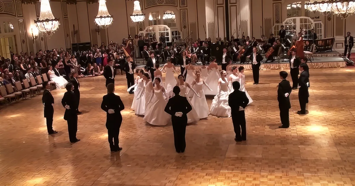Couples performing complex synchronized Viennese Waltz