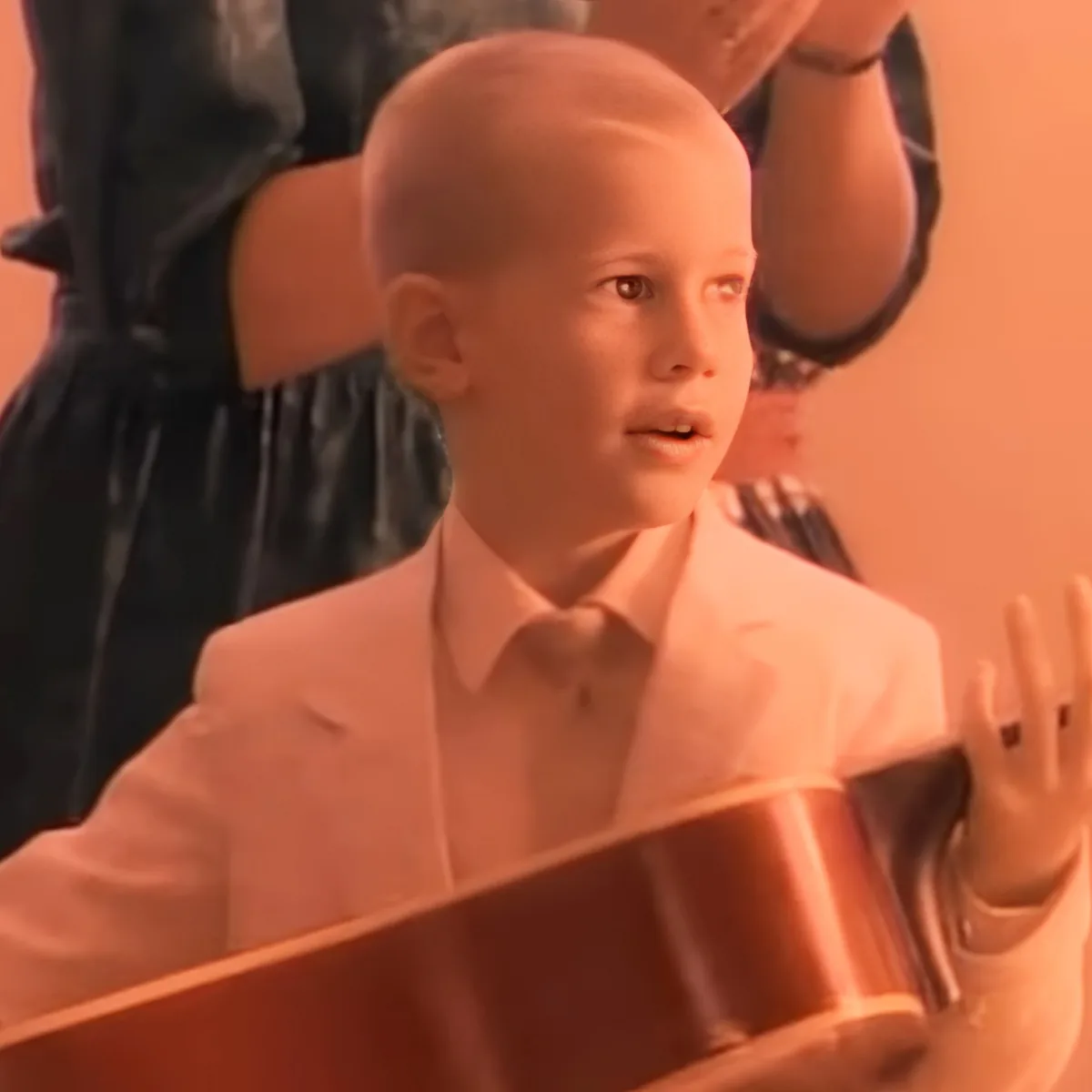 Little boy holding guitar