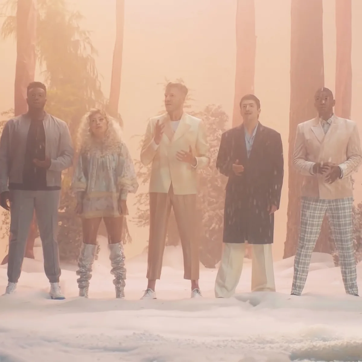 A group of five people in formal attire stands together in a hazy, snowy environment.