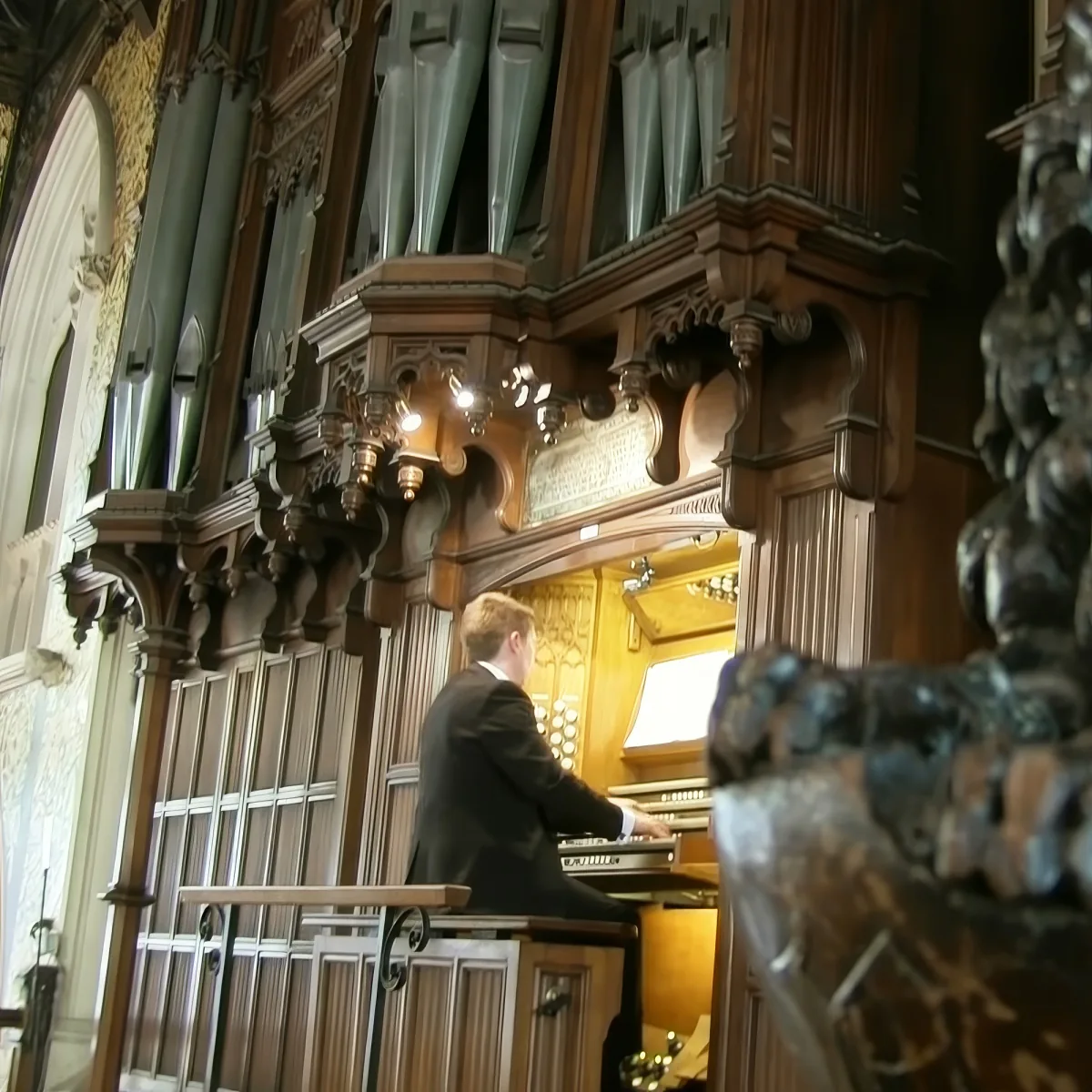 Man playing pipe organ