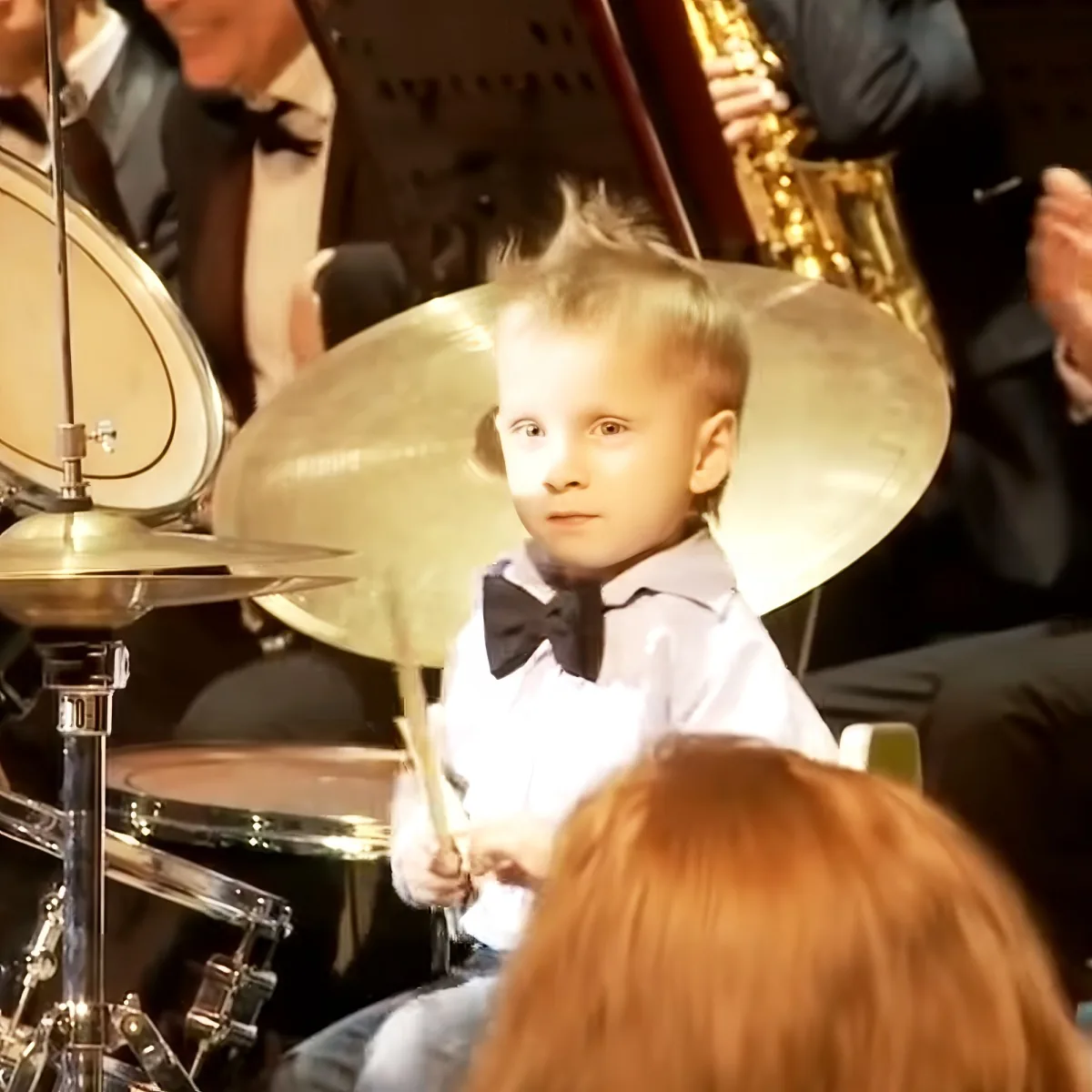 3-year-old boy playing the drums