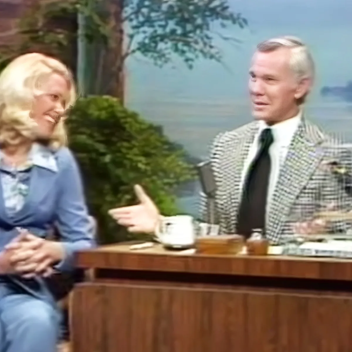 Johnny Carson and Joan Embry with a talking bird