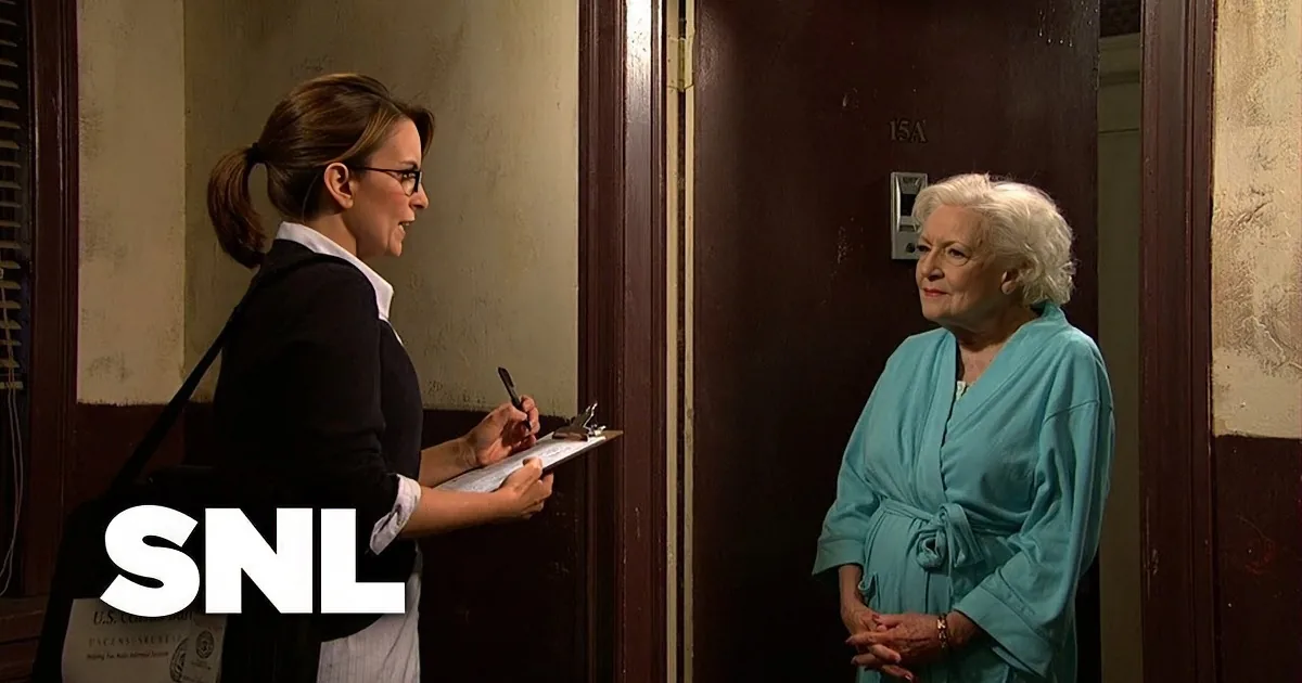 A census worker in a black blazer holds a clipboard, interacting with a woman in a teal robe at a door.