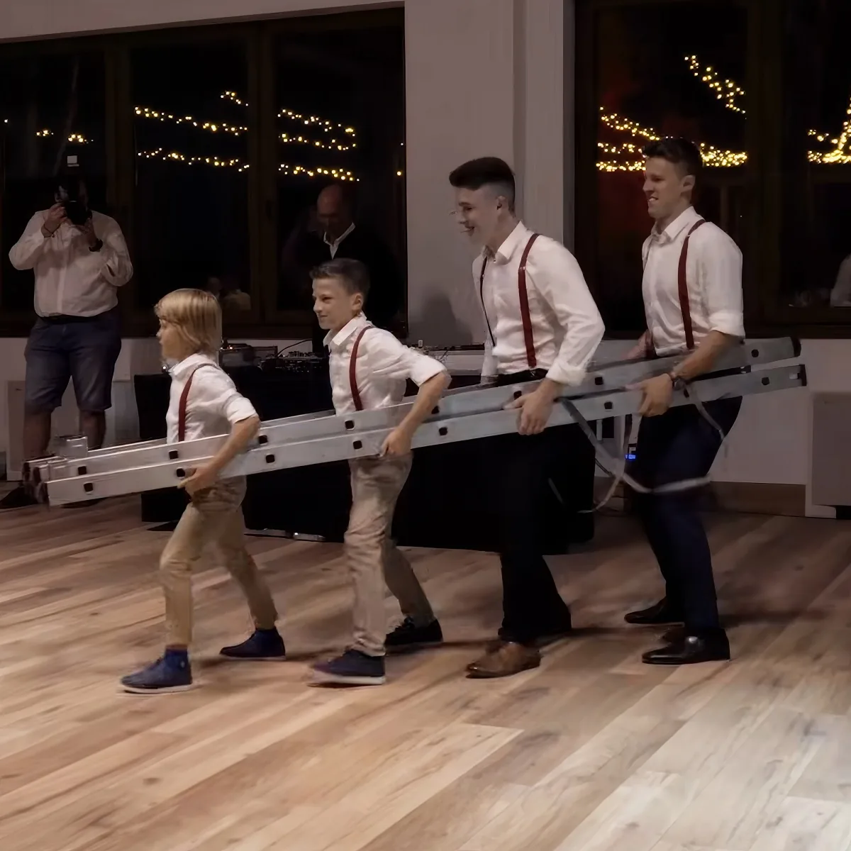 Brothers' wedding dance on ladder