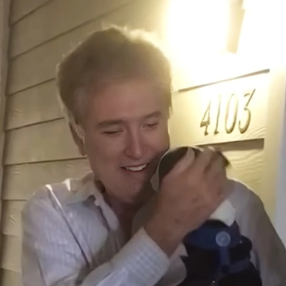 Tiny Terrier with owner