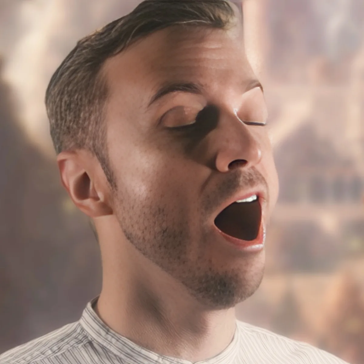 A man with short hair and a striped shirt is yawning widely, with his eyes closed and mouth open.
