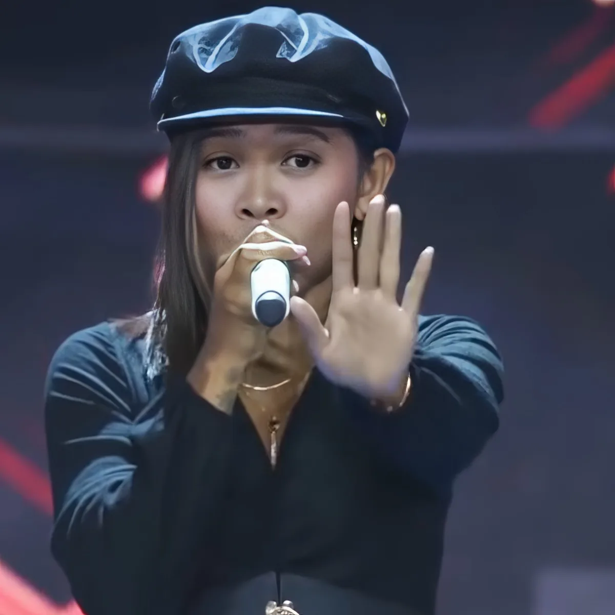 Singer performing in "The Voice"
