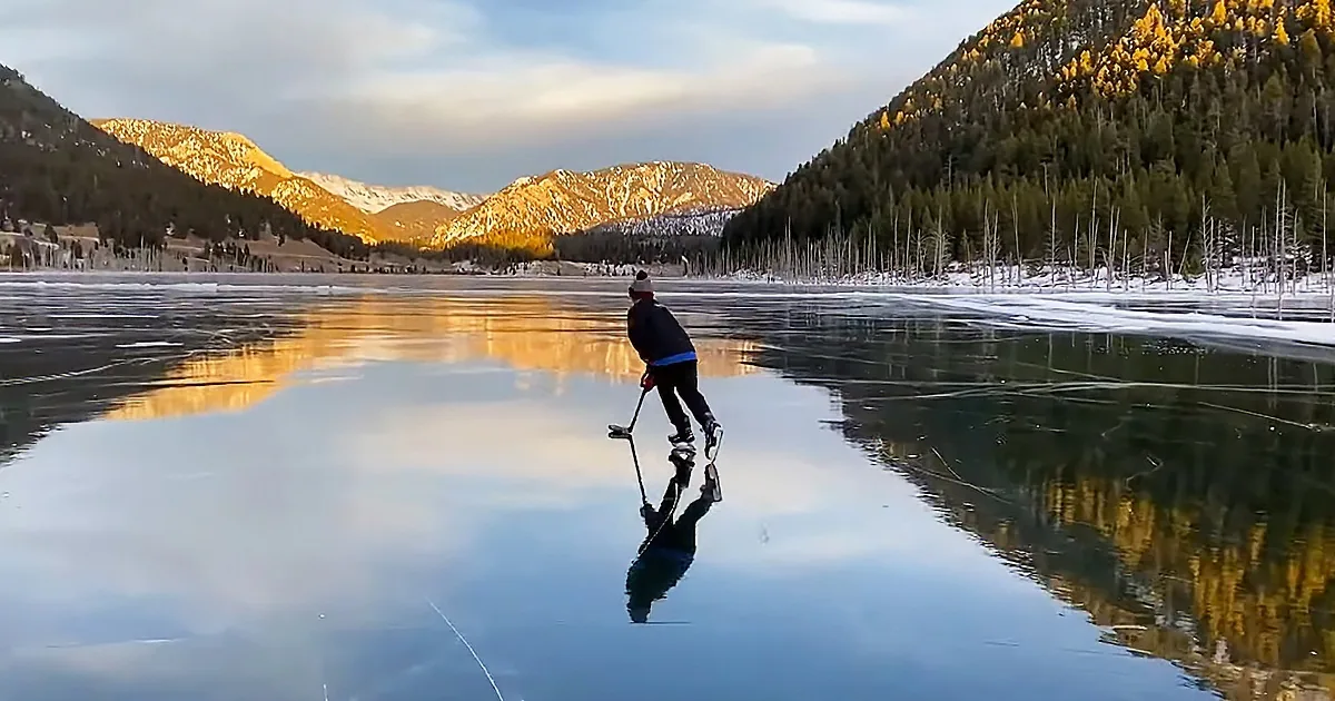 Two Kids Practice Their Hockey Skills on a Frozen Quake Lake
