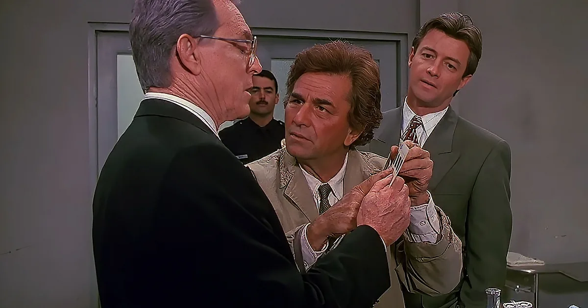 An older man in a suit holds a document, while another man in a tan jacket looks on, with a third man in a green suit...