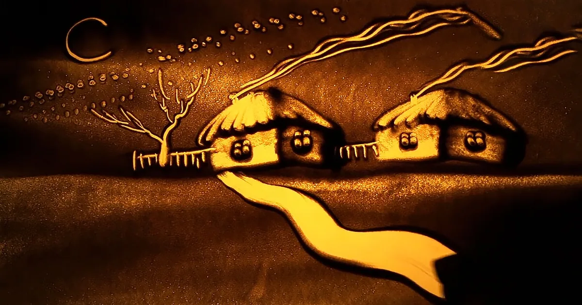 A sand art scene depicts a serene night with two houses, a crescent moon, and a tree, all illuminated by a warm light.