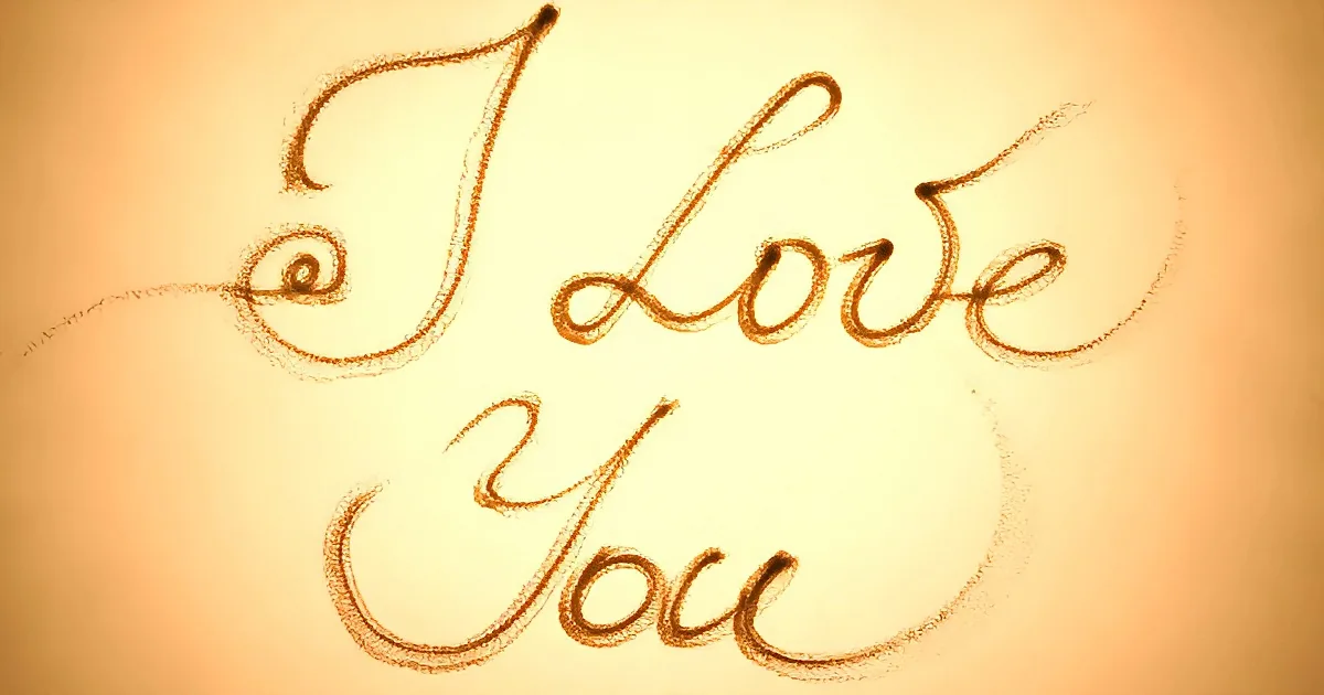 The phrase "I Love You" written in elegant cursive script on a warm-toned background.