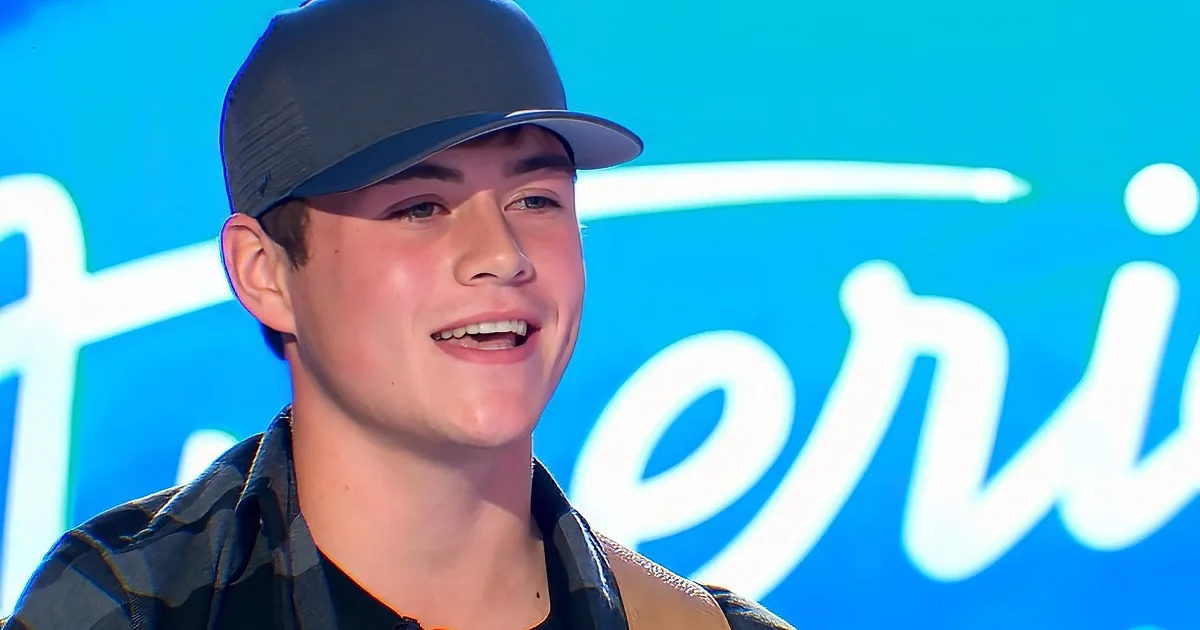 A young man wearing a cap and plaid shirt smiles, with a blue background featuring white text.