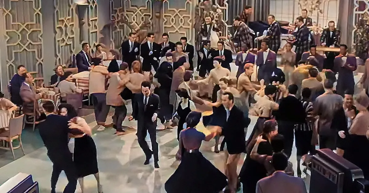 A lively dance scene with couples in formal attire moving gracefully in a grand ballroom.
