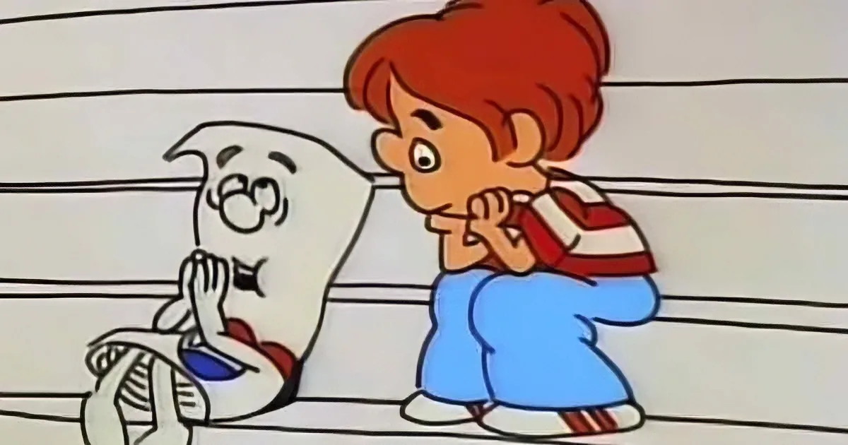 A cartoon boy with red hair and a backpack looks at a white ghost with a flashlight.