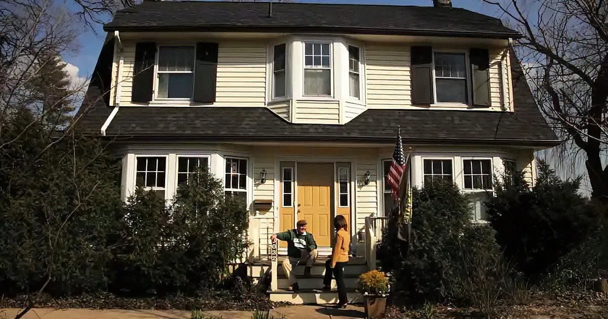 Couple in front of sears' catalog home