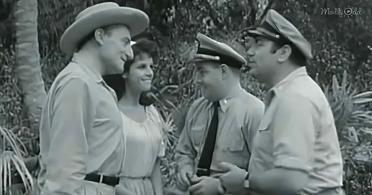 A man in a cowboy hat smiles at a woman in a white dress, while two men in uniforms converse nearby.