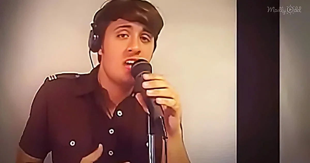 A person wearing headphones sings into a microphone, dressed in a black shirt with white buttons.