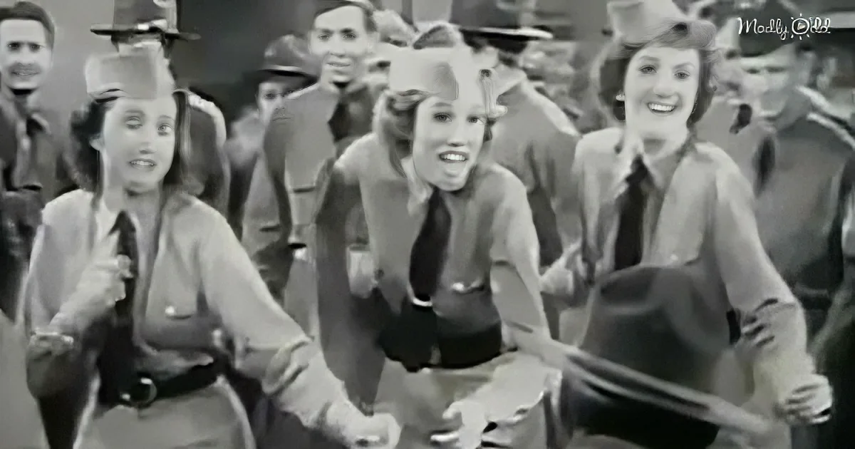 Women in uniform dance joyfully, holding hands, in a lively scene.