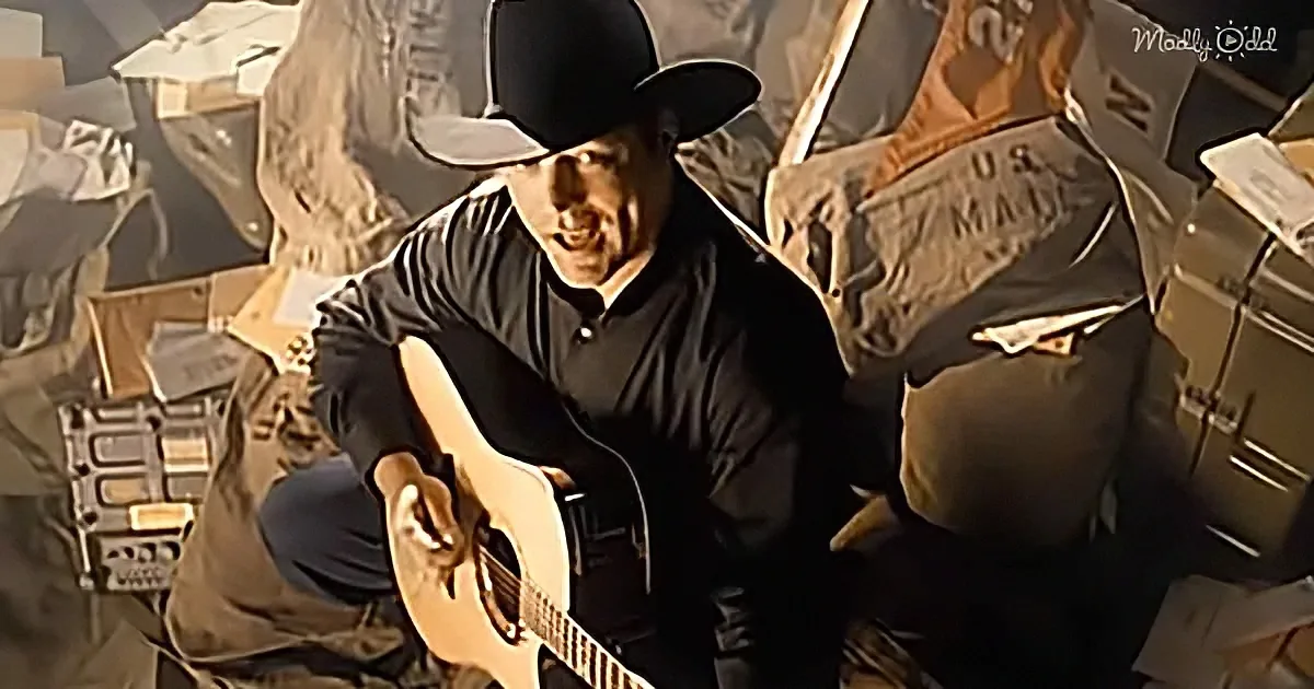 A man in a cowboy hat plays an acoustic guitar amidst a cluttered, sepia-toned background.